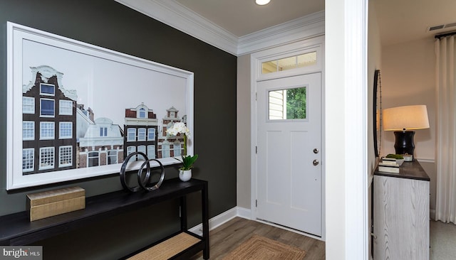 entryway featuring ornamental molding and dark wood-type flooring