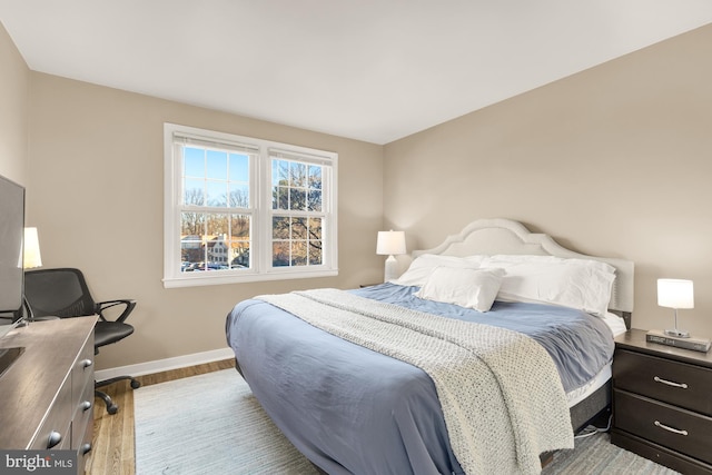 bedroom with light hardwood / wood-style floors