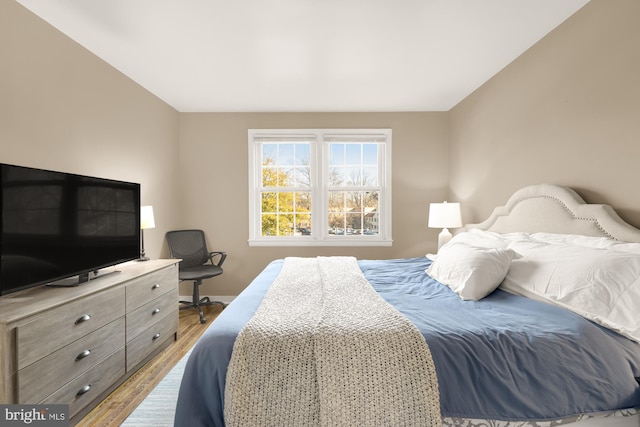 bedroom with light hardwood / wood-style floors