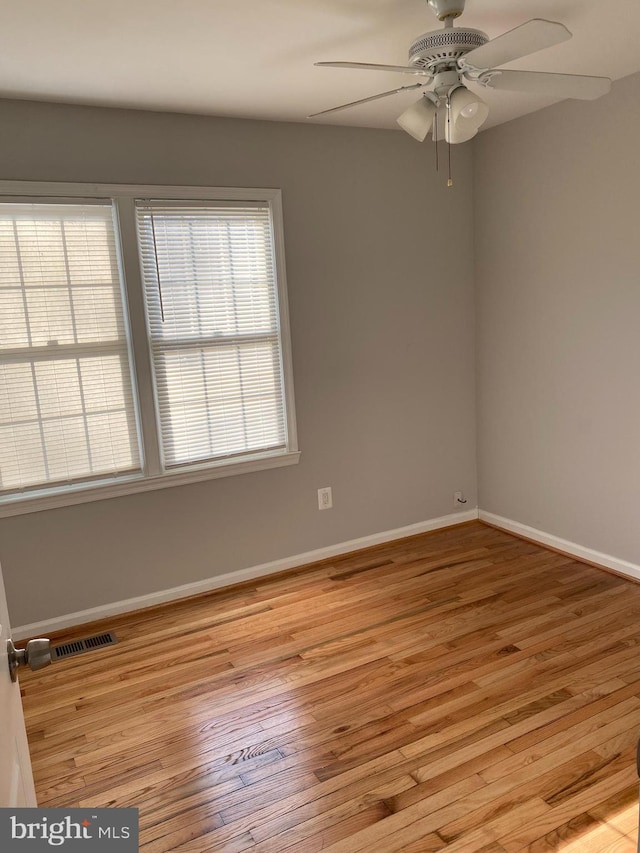 unfurnished room featuring ceiling fan and light wood-type flooring