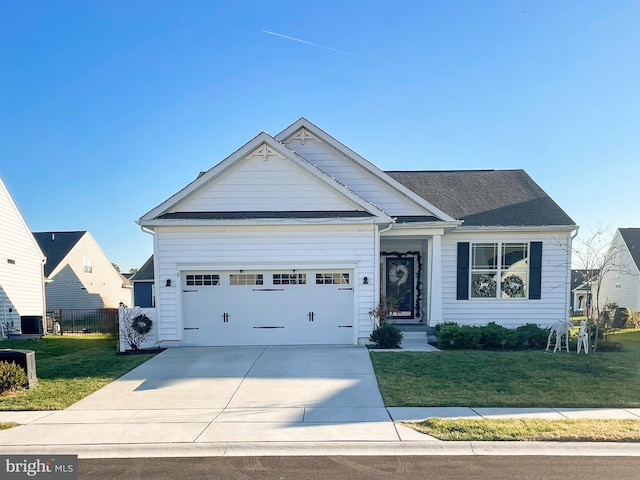 craftsman-style house with a front lawn and a garage