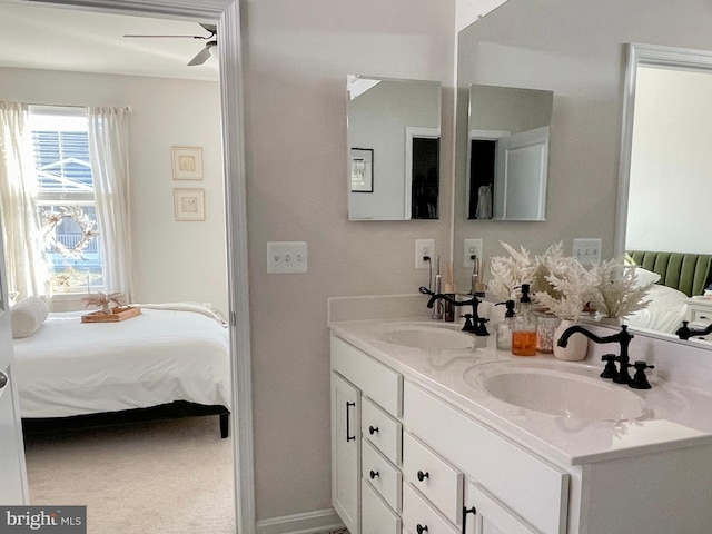 bathroom with ceiling fan and vanity