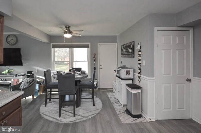 dining area featuring light wood-type flooring and ceiling fan