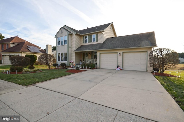 view of front property with a garage and a front lawn