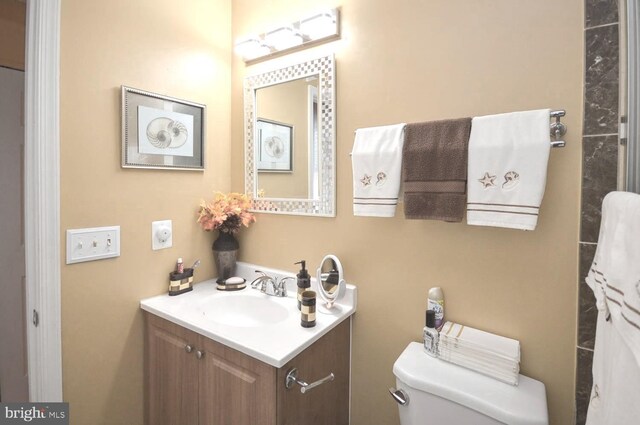 bathroom with vanity and toilet