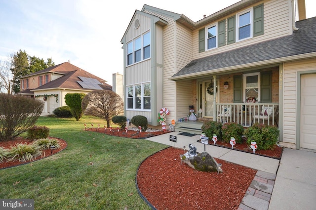 view of front facade featuring a porch and a front yard