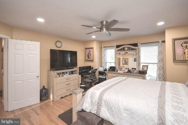 bedroom featuring ceiling fan and light hardwood / wood-style flooring