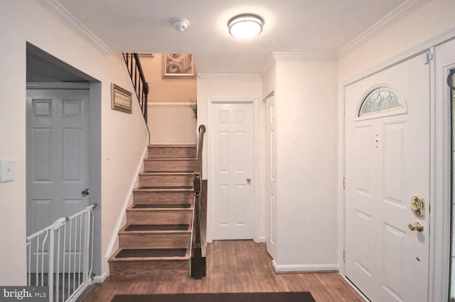 foyer featuring hardwood / wood-style flooring and ornamental molding