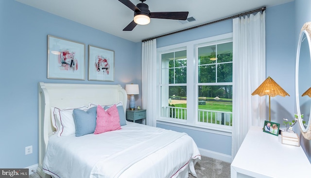 bedroom featuring ceiling fan and carpet floors