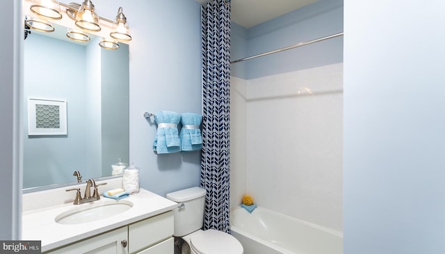 full bathroom featuring vanity, shower / bath combination, and toilet