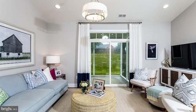 living room with light hardwood / wood-style floors