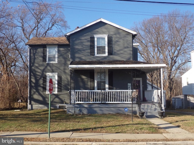 view of front of home featuring a porch and a front lawn