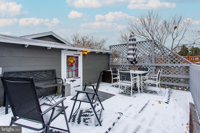 view of snow covered deck