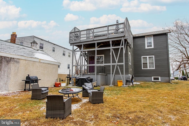 back of house featuring an outdoor hangout area, a deck, and a lawn