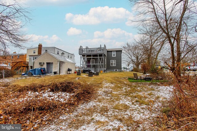 rear view of property featuring a sunroom