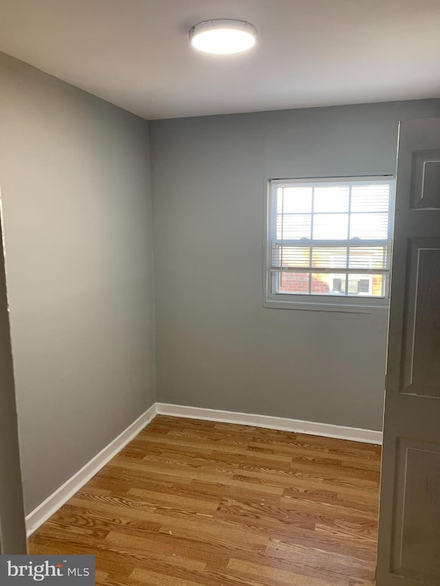 unfurnished room featuring light hardwood / wood-style flooring