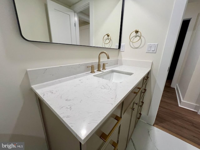 bathroom with vanity and hardwood / wood-style flooring