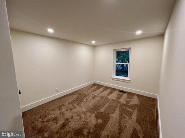 spare room with carpet floors