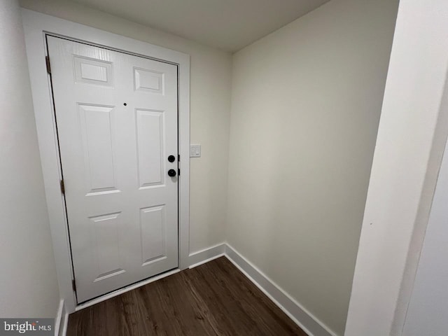 entryway with dark wood-type flooring