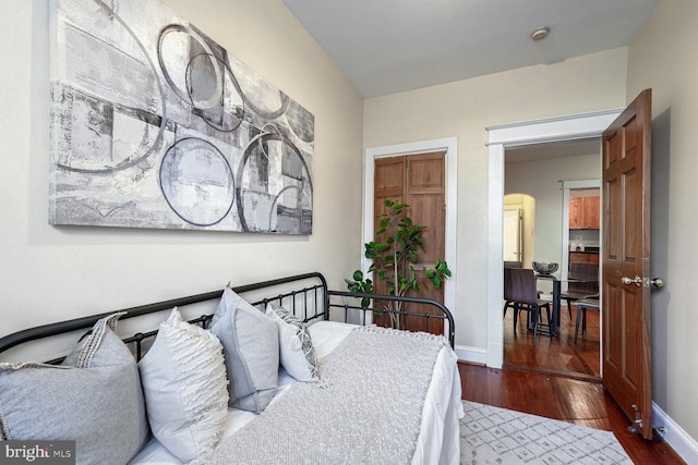 bedroom featuring dark wood-type flooring