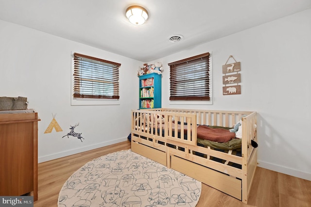 bedroom featuring light hardwood / wood-style floors