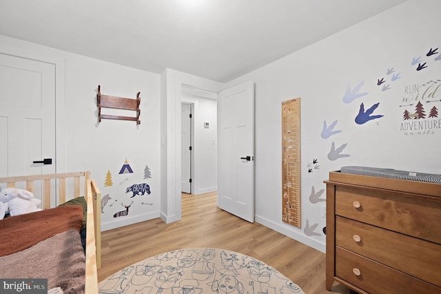 bedroom with light wood-type flooring