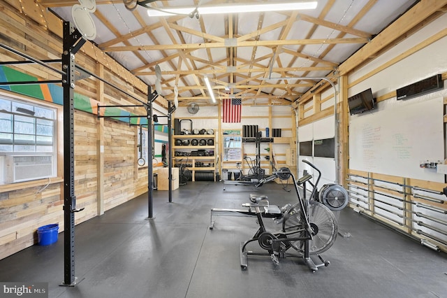 workout area featuring high vaulted ceiling and cooling unit