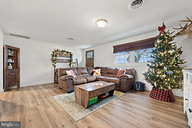 living room with light hardwood / wood-style floors