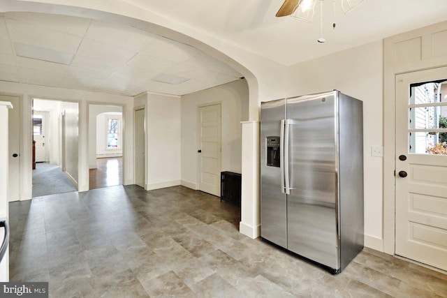 kitchen with stainless steel fridge with ice dispenser and ceiling fan