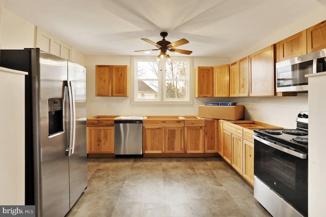 kitchen with ceiling fan and stainless steel appliances