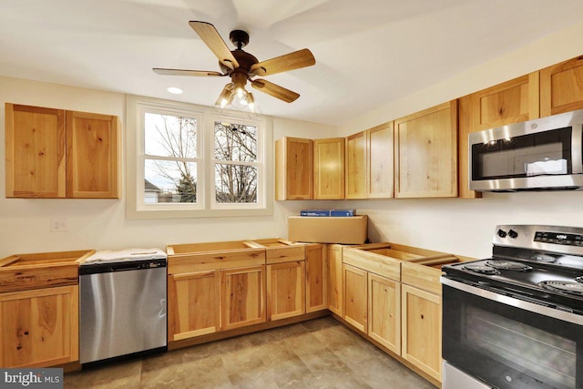 kitchen with ceiling fan and stainless steel appliances