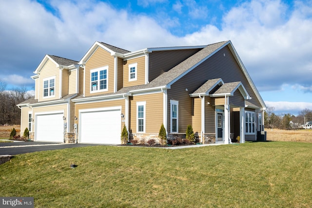 view of front facade with a front yard and a garage