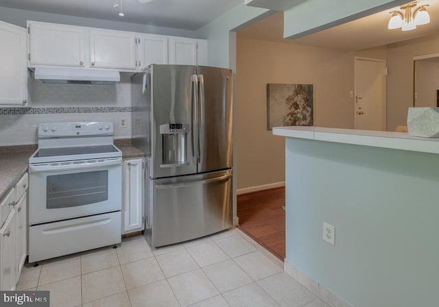 kitchen with stainless steel refrigerator with ice dispenser, backsplash, light tile patterned floors, white cabinets, and white electric range