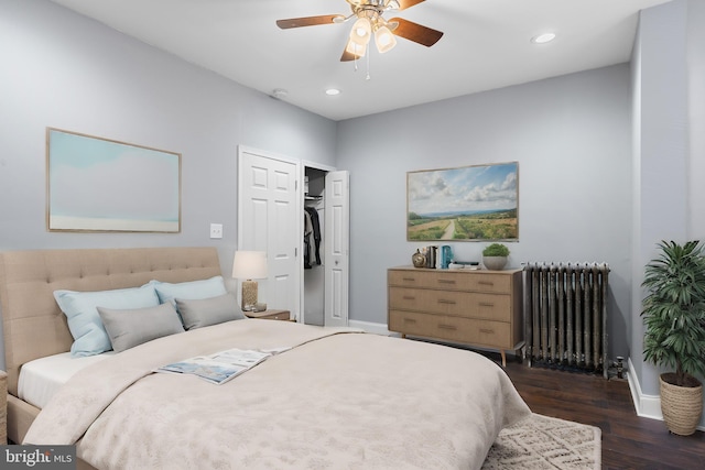 bedroom featuring ceiling fan, dark hardwood / wood-style flooring, and radiator