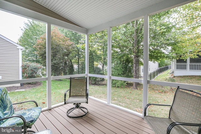 unfurnished sunroom with vaulted ceiling