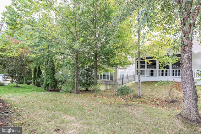 view of yard featuring a sunroom