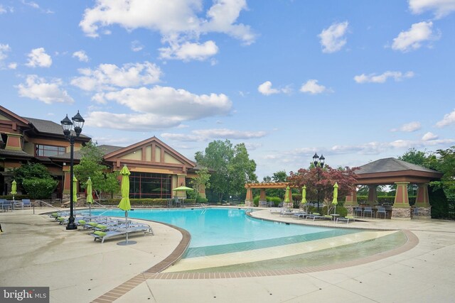 view of swimming pool with a gazebo and a patio