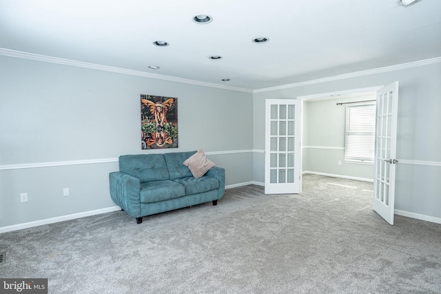 sitting room with carpet, french doors, and crown molding