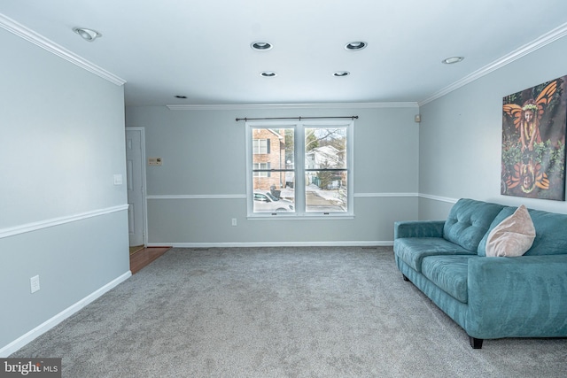 sitting room featuring carpet flooring and ornamental molding