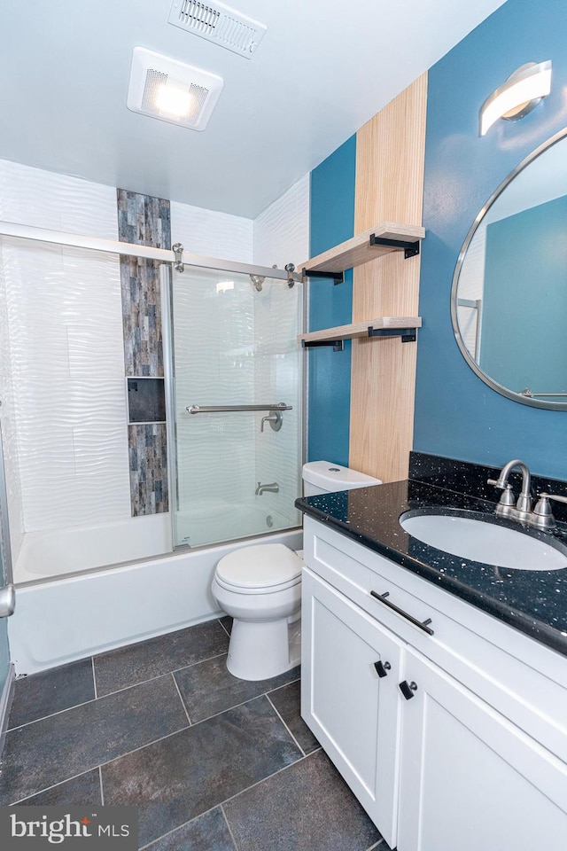 full bathroom with toilet, vanity, and shower / bath combination with glass door