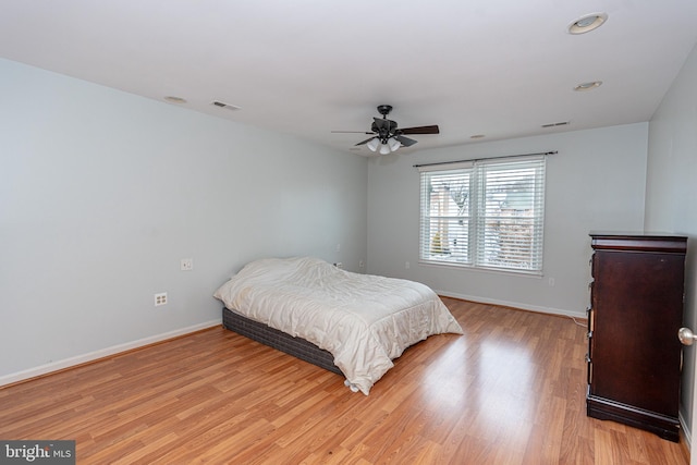 bedroom featuring ceiling fan and light wood-type flooring