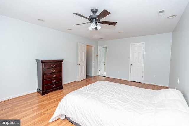 bedroom with ceiling fan and light hardwood / wood-style flooring