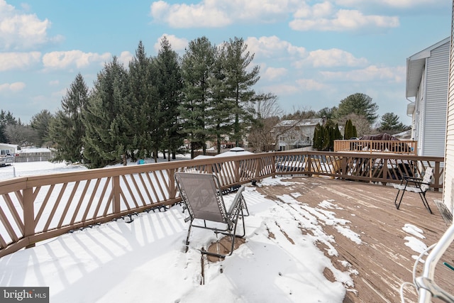 view of snow covered deck