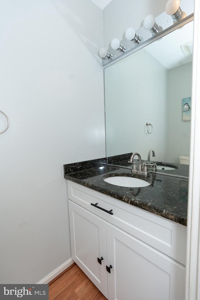 bathroom featuring vanity and hardwood / wood-style floors