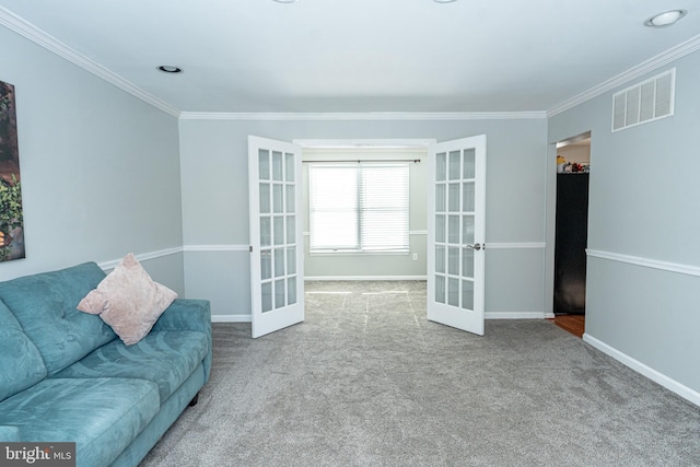 unfurnished living room featuring crown molding, french doors, and carpet floors