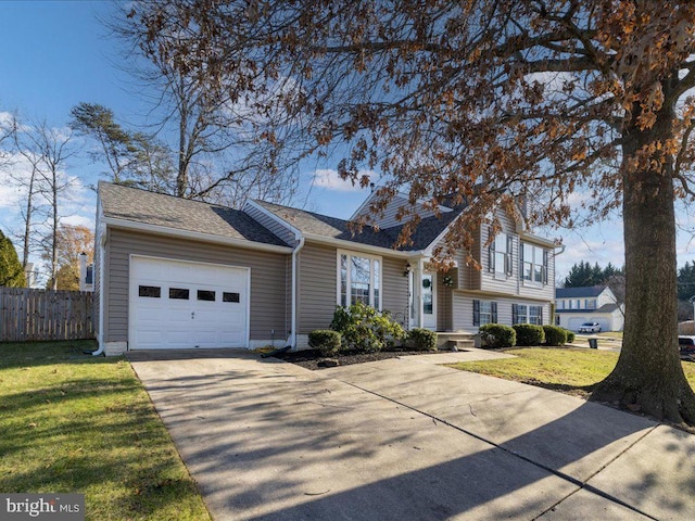 view of front facade featuring a garage and a front yard