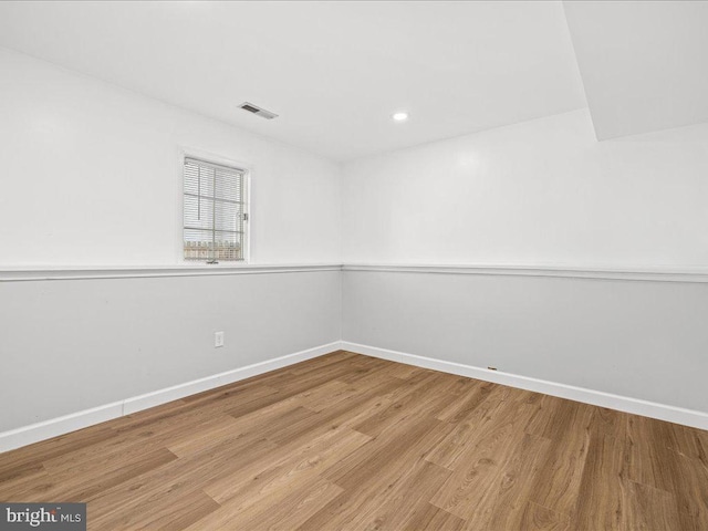 unfurnished room featuring light hardwood / wood-style flooring