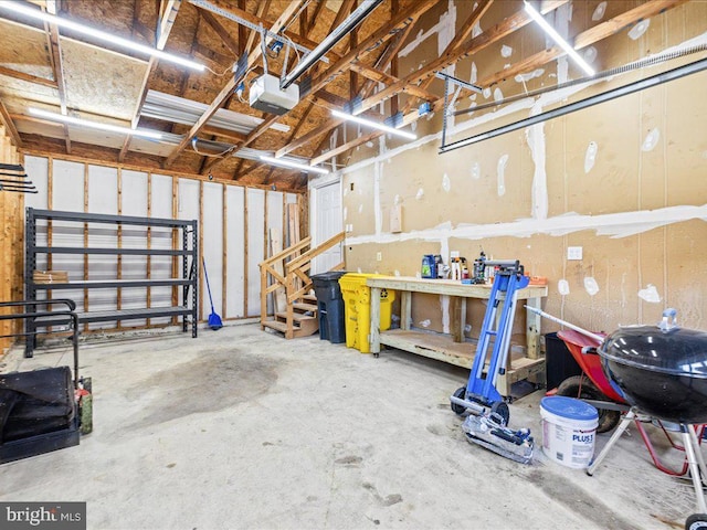 garage featuring a workshop area and a garage door opener