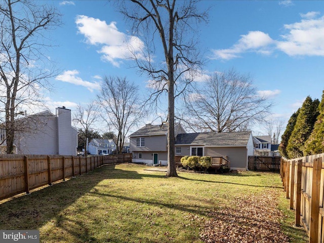 view of yard with a wooden deck