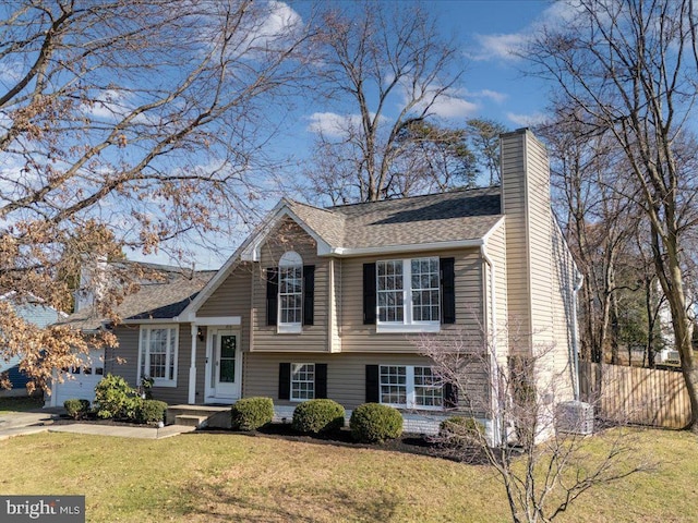 split level home featuring a front yard